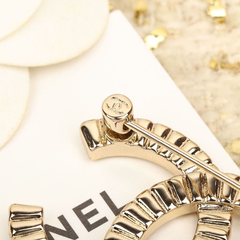 Ch**el brooches